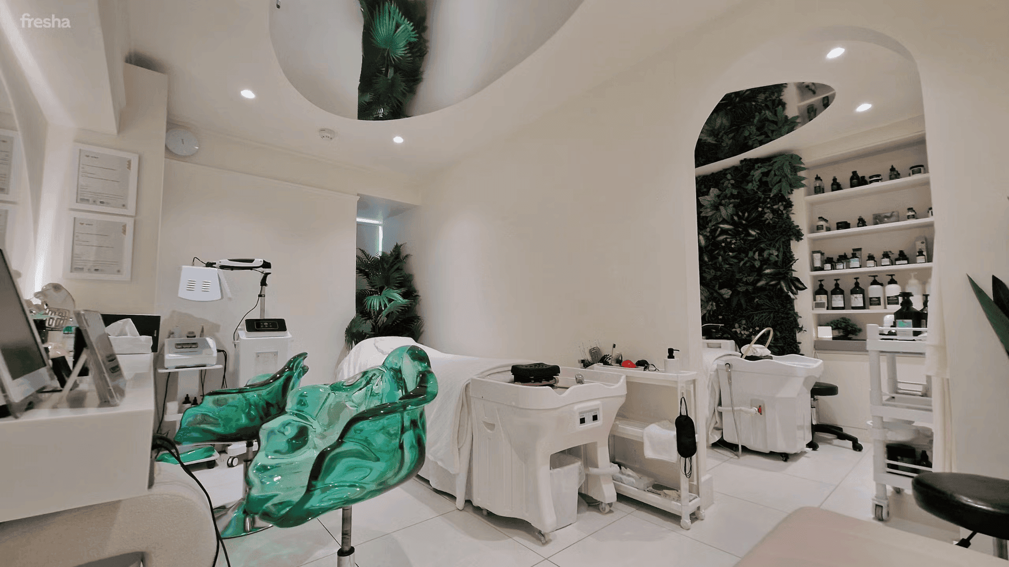 white salon with green and white chairs