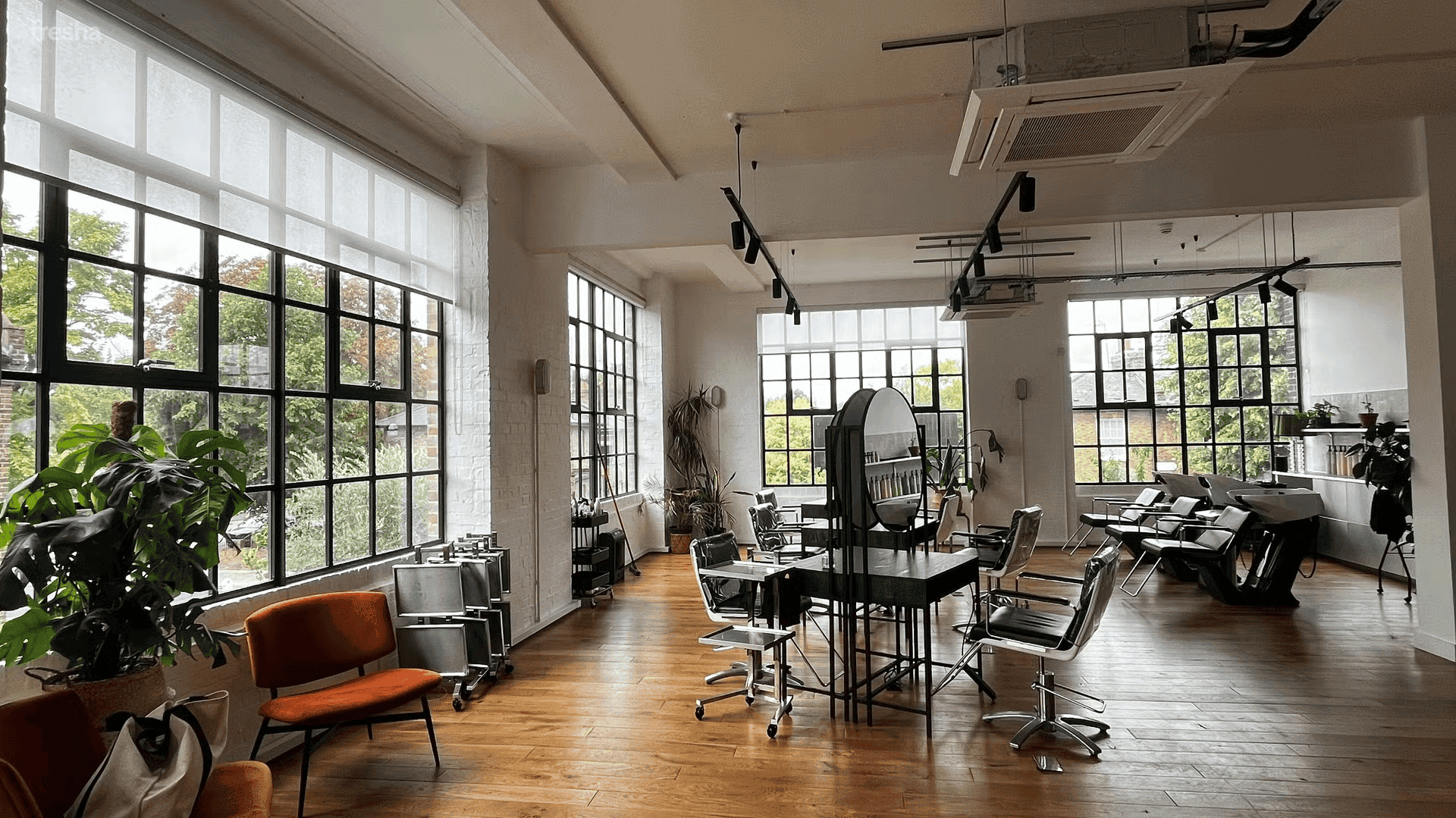 photo of studio 90 in dalston with hairdressing chairs and windows