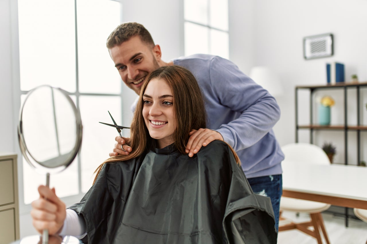 Hairdresser straightening outlet hair