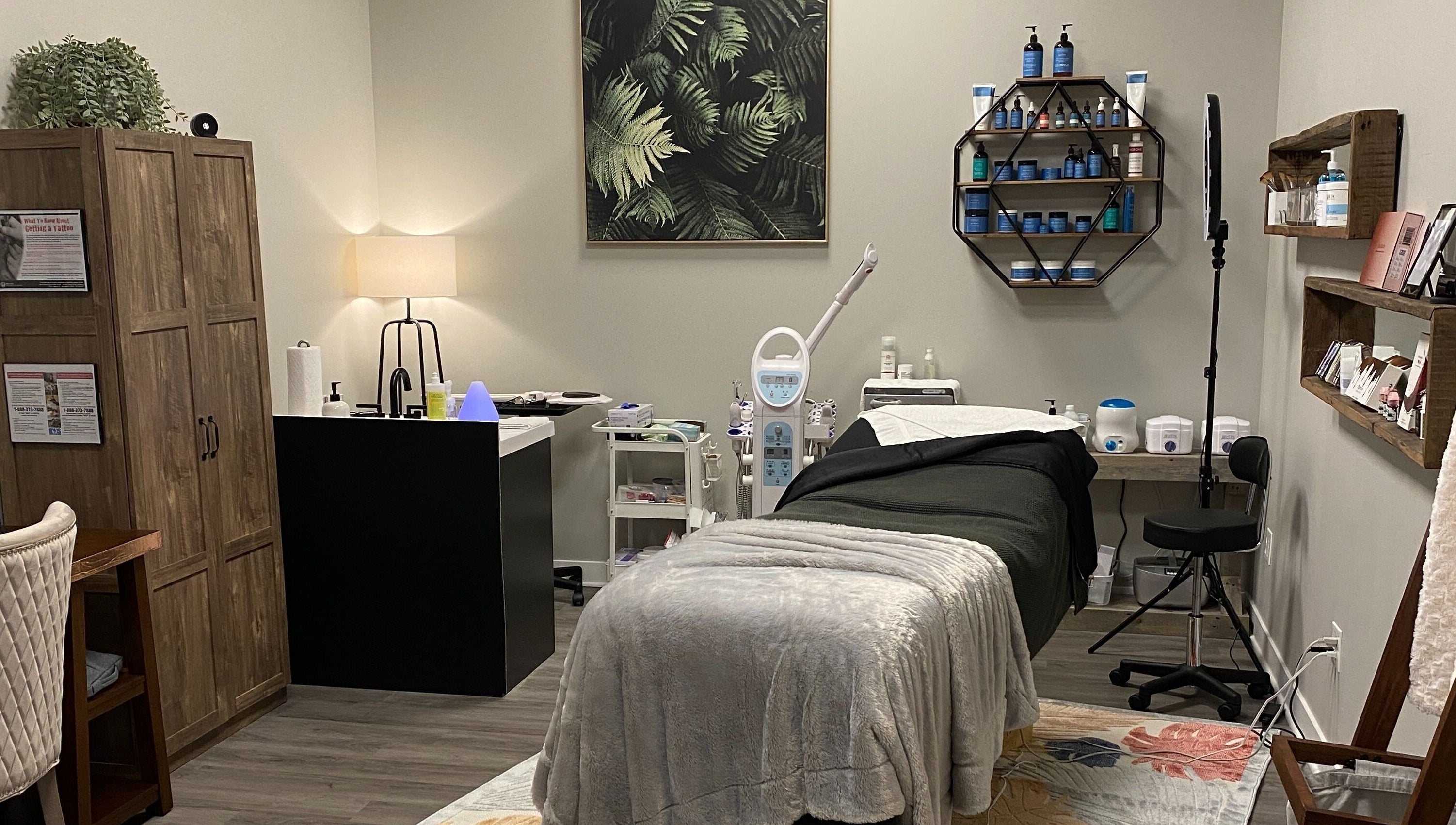 Cozy treatment room at Refined Esthetics in Dekalb, Illinois, US, featuring modern equipment and serene decor.