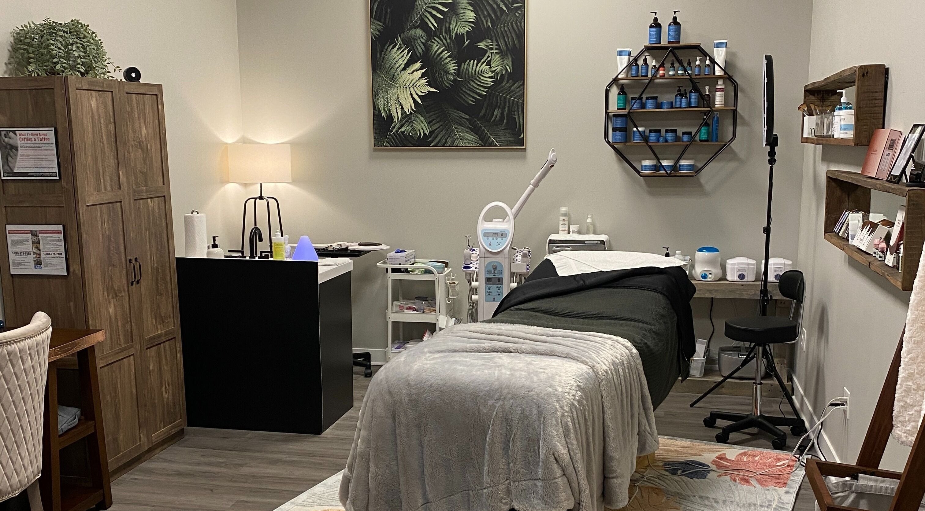 Cozy treatment room at Refined Esthetics in Dekalb, Illinois, US, featuring modern equipment and serene decor.