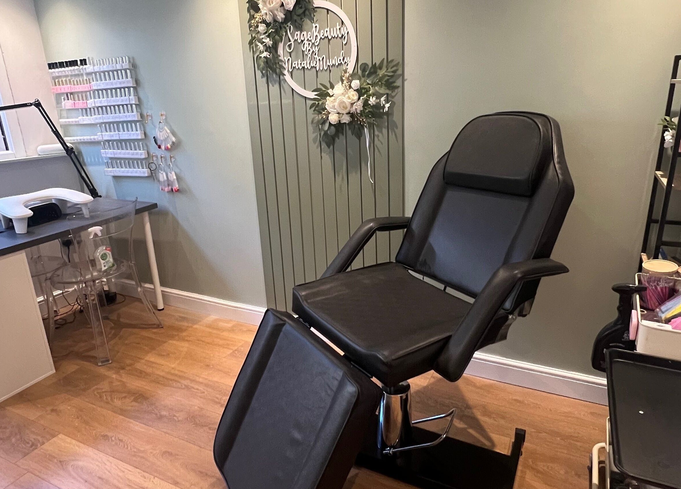 Relaxing treatment room at Sage Beauty in Highworth, England, GB showcasing a comfortable chair and nail station.