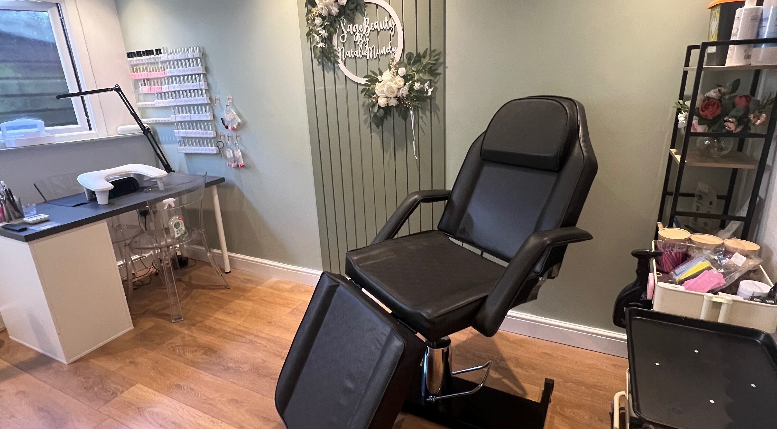 Relaxing treatment room at Sage Beauty in Highworth, England, GB showcasing a comfortable chair and nail station.
