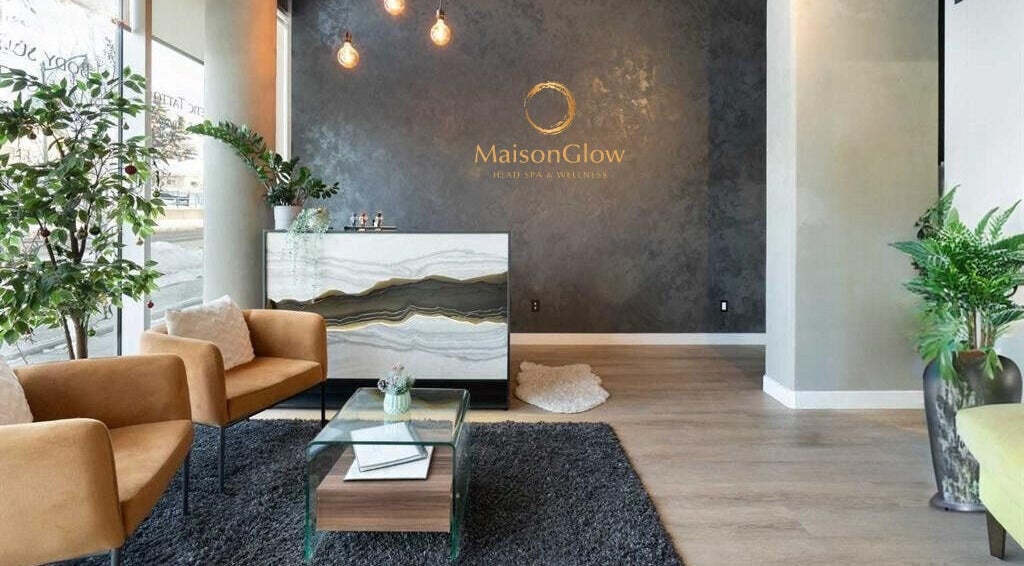 Elegant reception at MaisonGlow Spa & Wellness, Calgary, Alberta, CA with chic decor and lush plants.