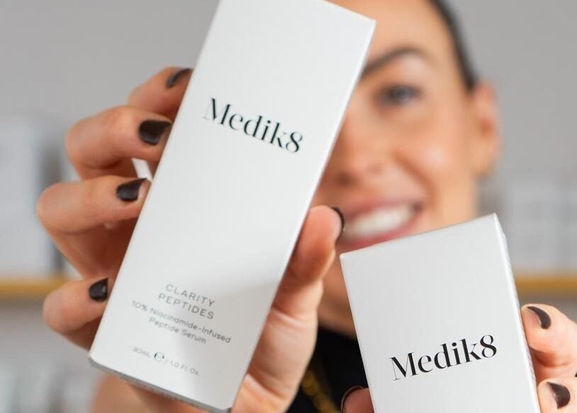 Hand showcasing Medik8 products at Bare Skin Clinic, Worsley, England, GB. Enhance your skincare routine today.