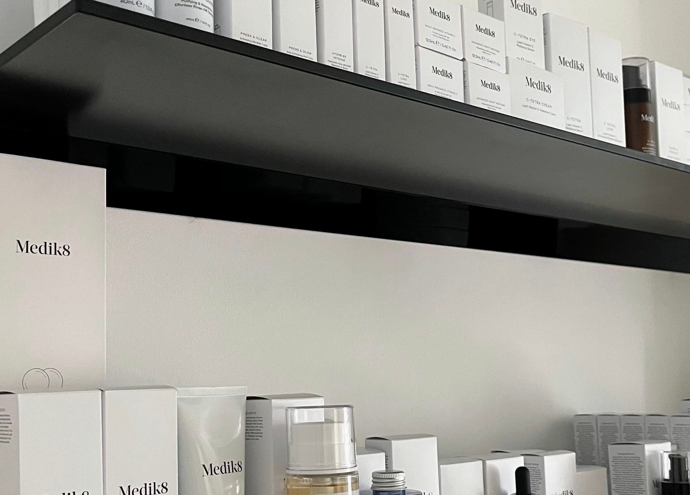 Medik8 products on sleek shelves at Bare Skin Clinic in Worsley, England, GB.