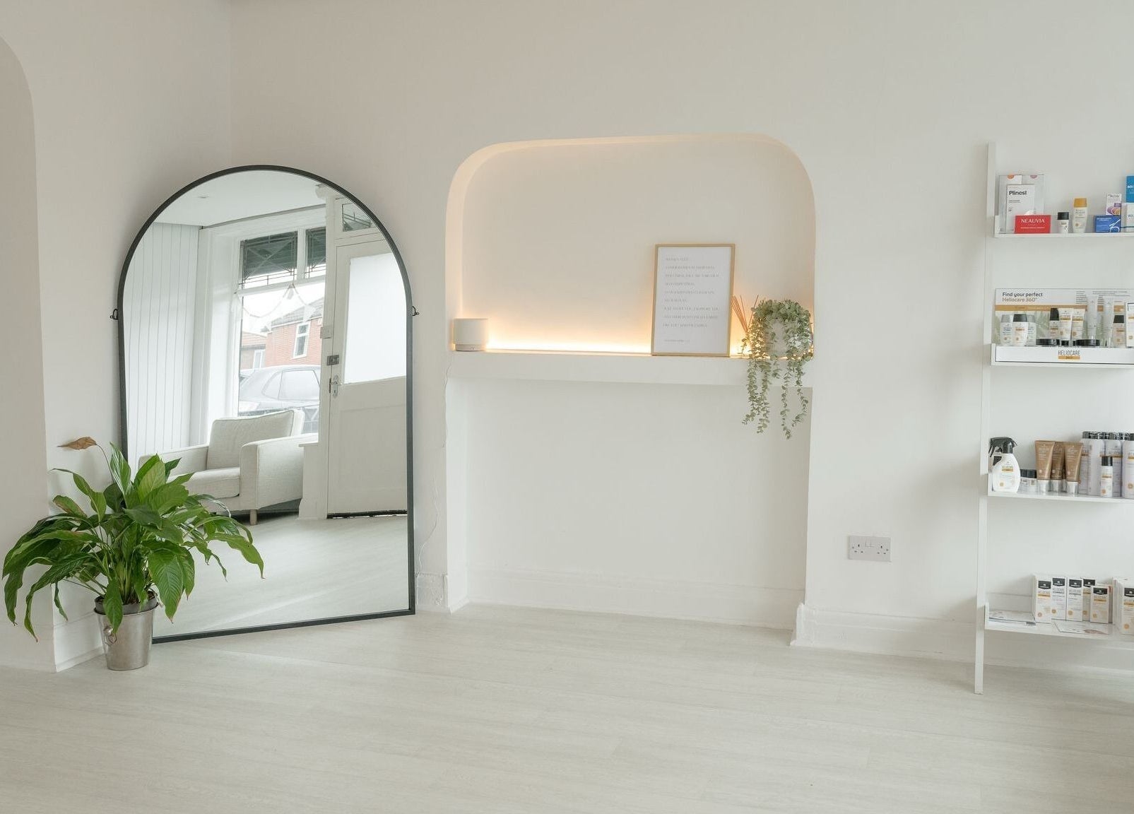 Modern interior of Bare Skin Clinic in Worsley, England, GB, featuring elegant decor and skincare products.