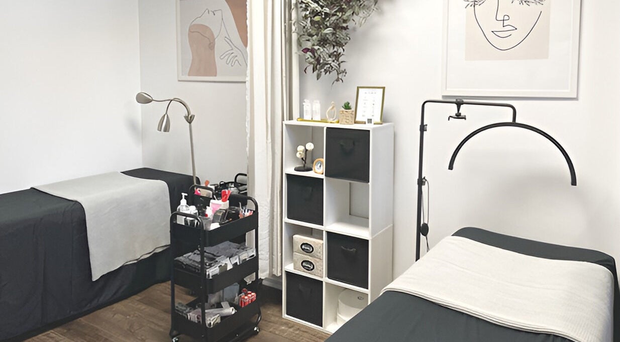 Cozy treatment room at Omalley Nails Beauty in Auckland, Auckland, NZ, featuring modern decor and comfortable beds.
