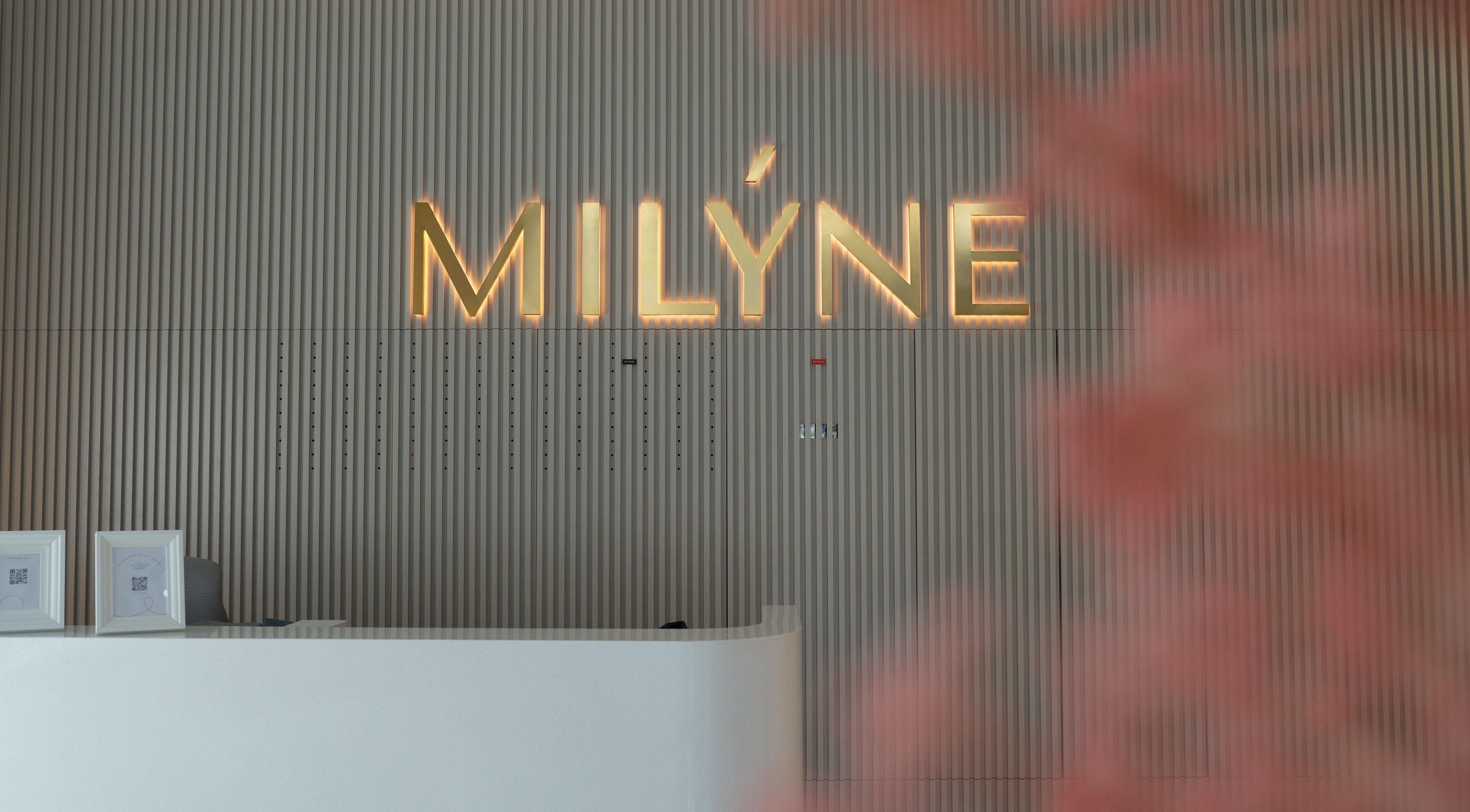 Milyne Aesthetic Center reception with illuminated logo in Dubai, Dubai, AE.