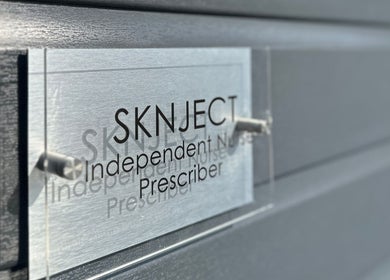 Close-up of Sknject's signage at Rotherham, England showcasing independent prescriber service.