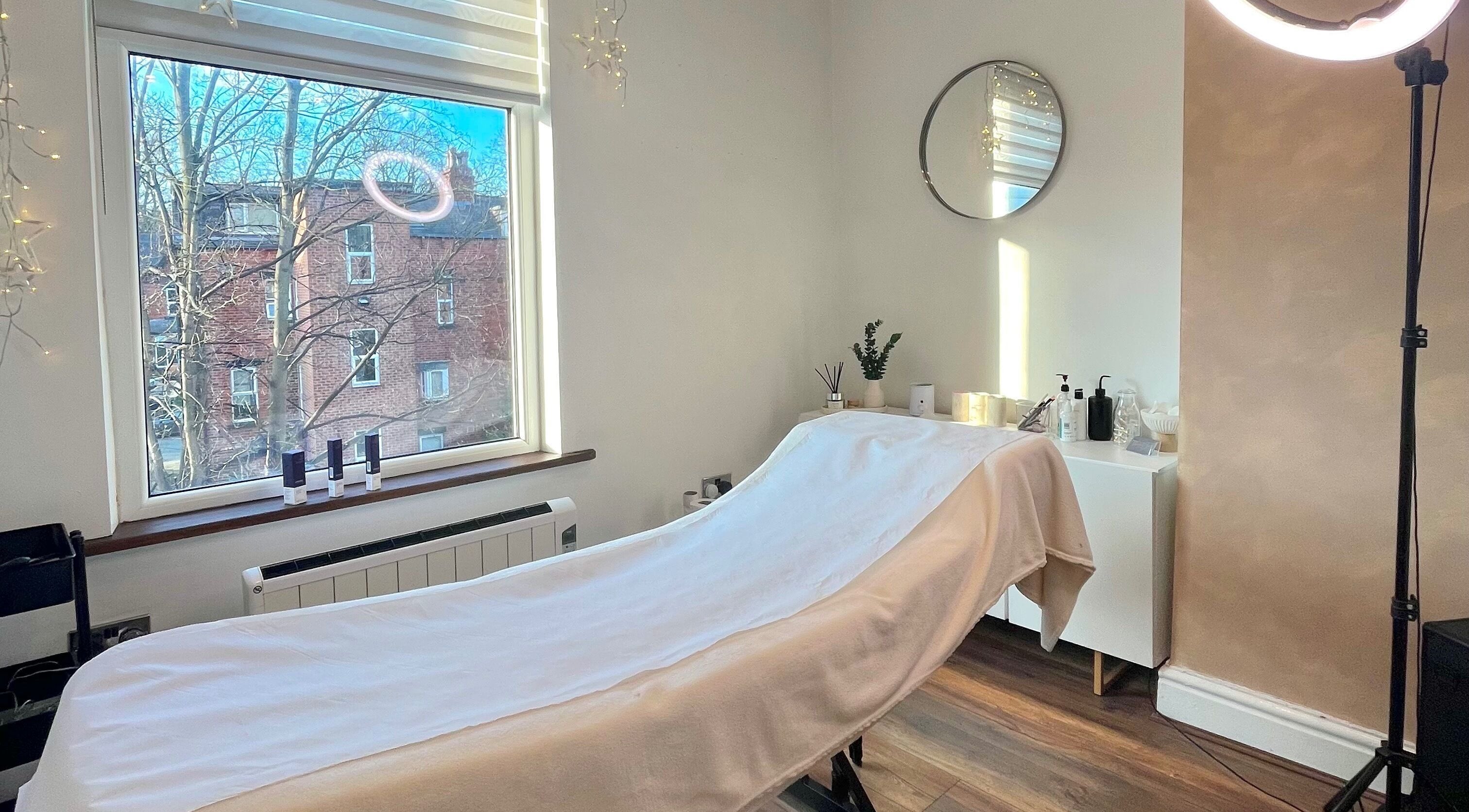 Relaxing spa room at Billie Butler Beauty in Leeds, England, GB with a treatment bed and natural light.