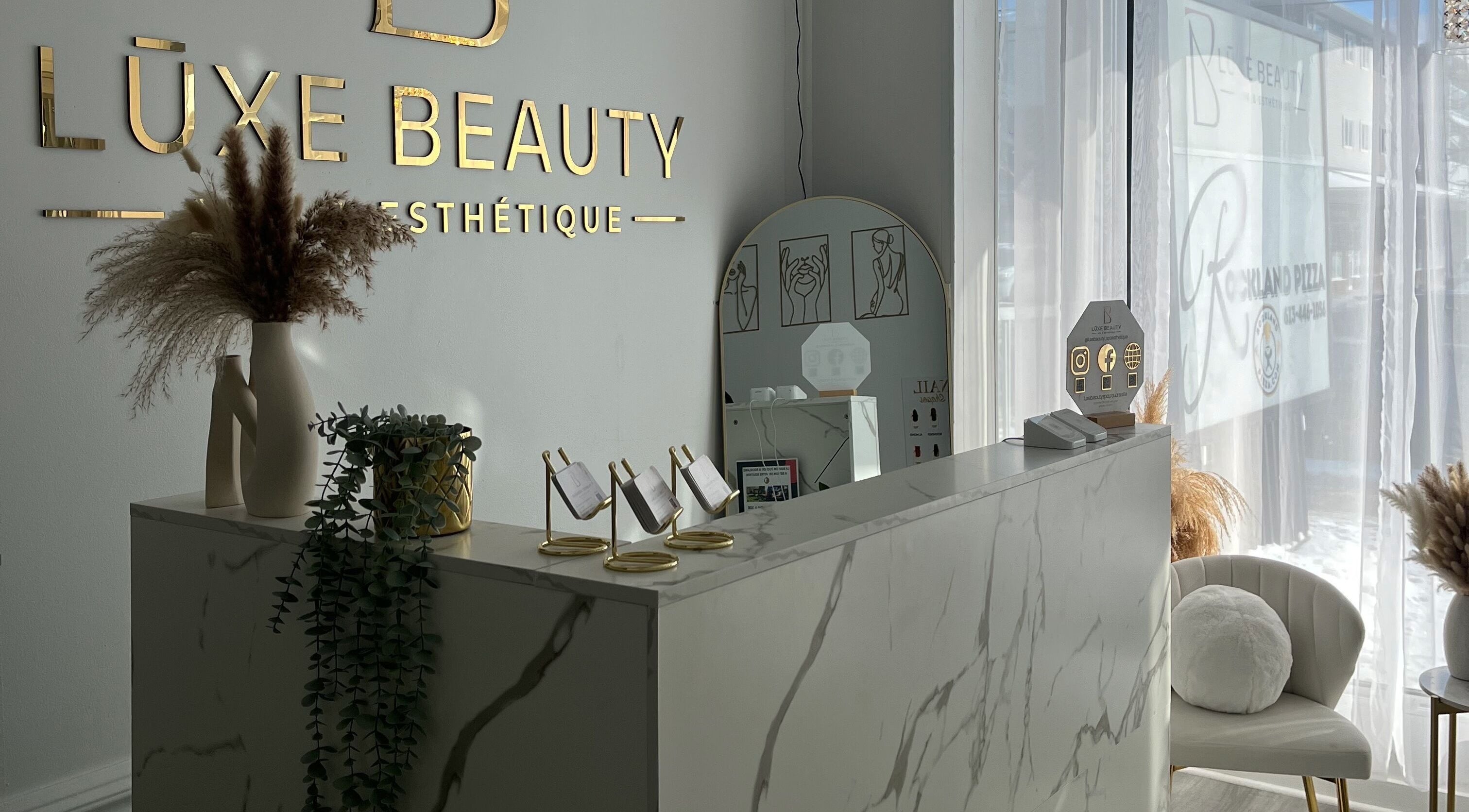 Reception area at Lūxe Beauty Spa & Esthétique in Clarence-rockland, Ontario, CA with elegant decor.