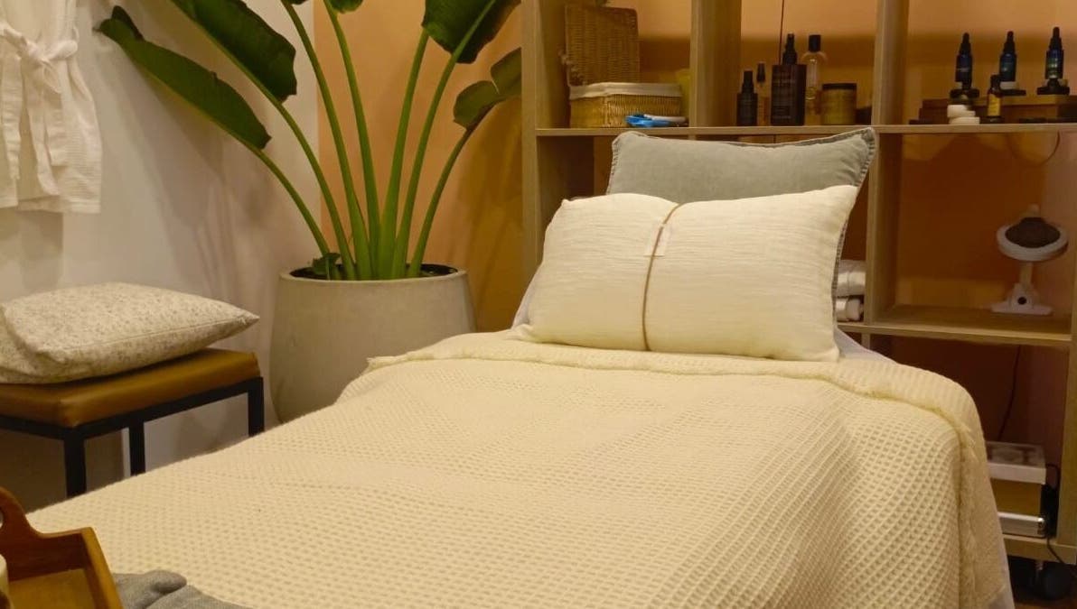 Cozy spa bed at Spa Spacio, Medellín, Antioquia, CO with plush pillows and serene decor.