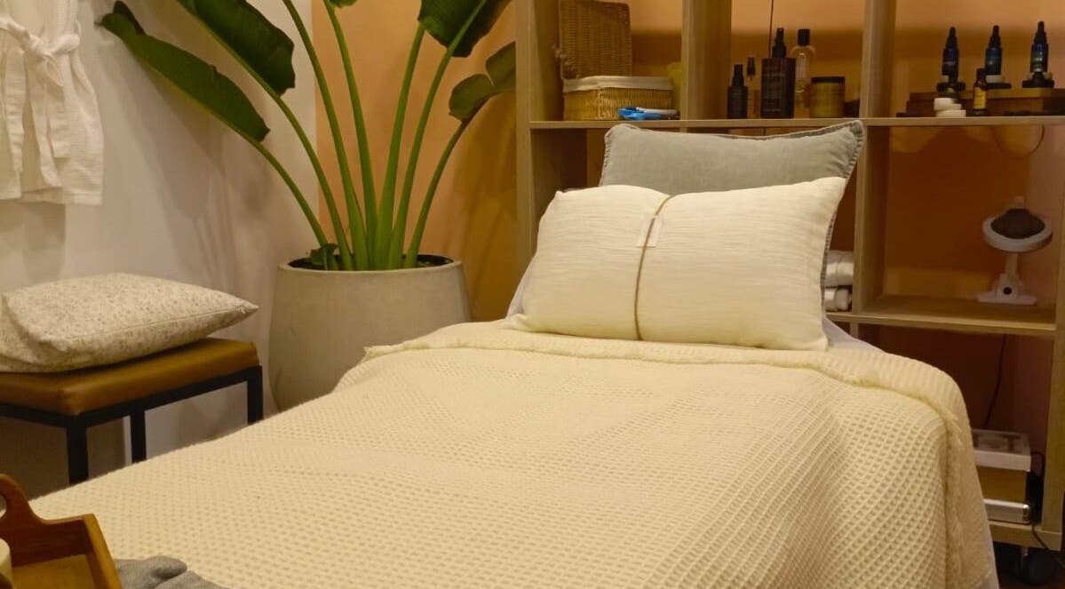 Cozy spa bed at Spa Spacio, Medellín, Antioquia, CO with plush pillows and serene decor.
