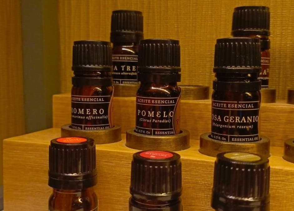 Essential oils on shelf at Spa Spacio, Medellín, Antioquia, CO. Enhance relaxation and wellness.