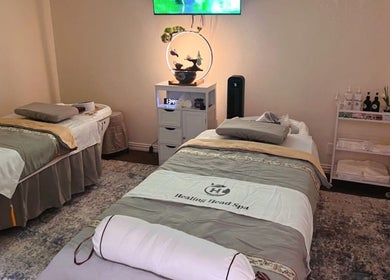 Relaxing massage room with two beds at Healing Head Spa, Arlington, Texas, US.