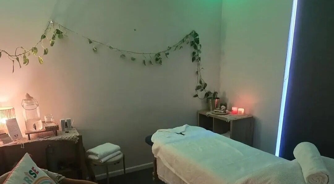 Tranquil massage room at RESTART-SE - Studio Southport, Southport, Queensland, AU with soft lighting and plants.