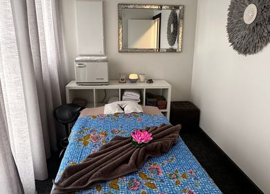 Serene massage room at Soothe & Soul. Waiuku Thai Massage Therapy, Auckland, NZ with floral decor.