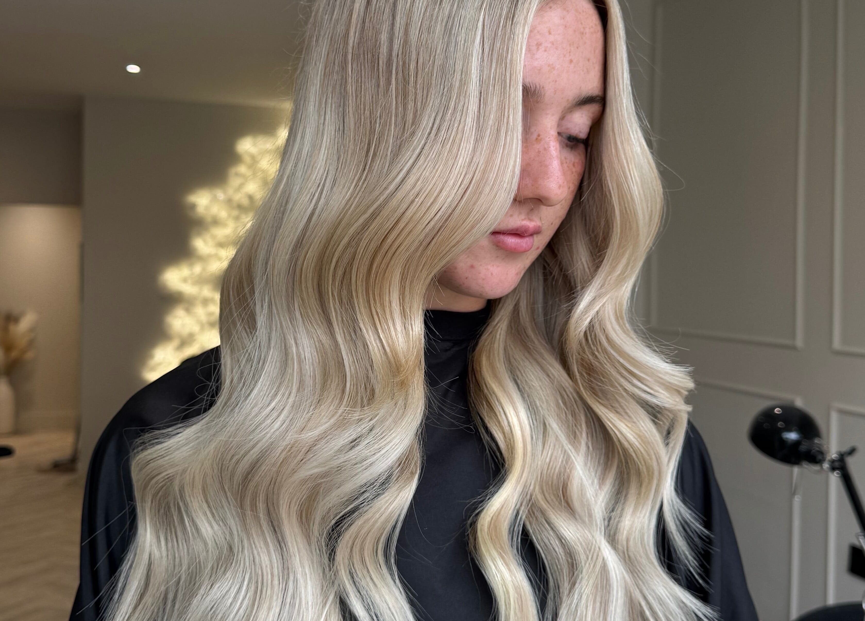 Elegant wavy blonde hairstyle at Mane Muse, Pendlebury, England, GB, enhancing natural beauty.