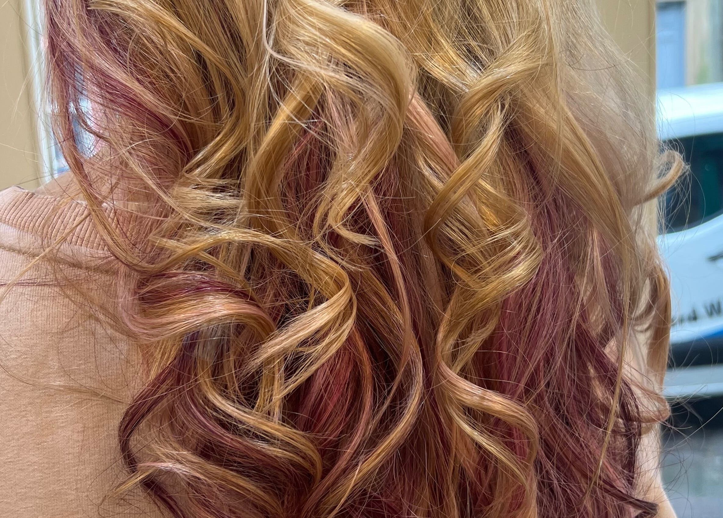 Stylish blonde and pink curls at Violets in Callander, Scotland, GB showcasing premium hair styling.