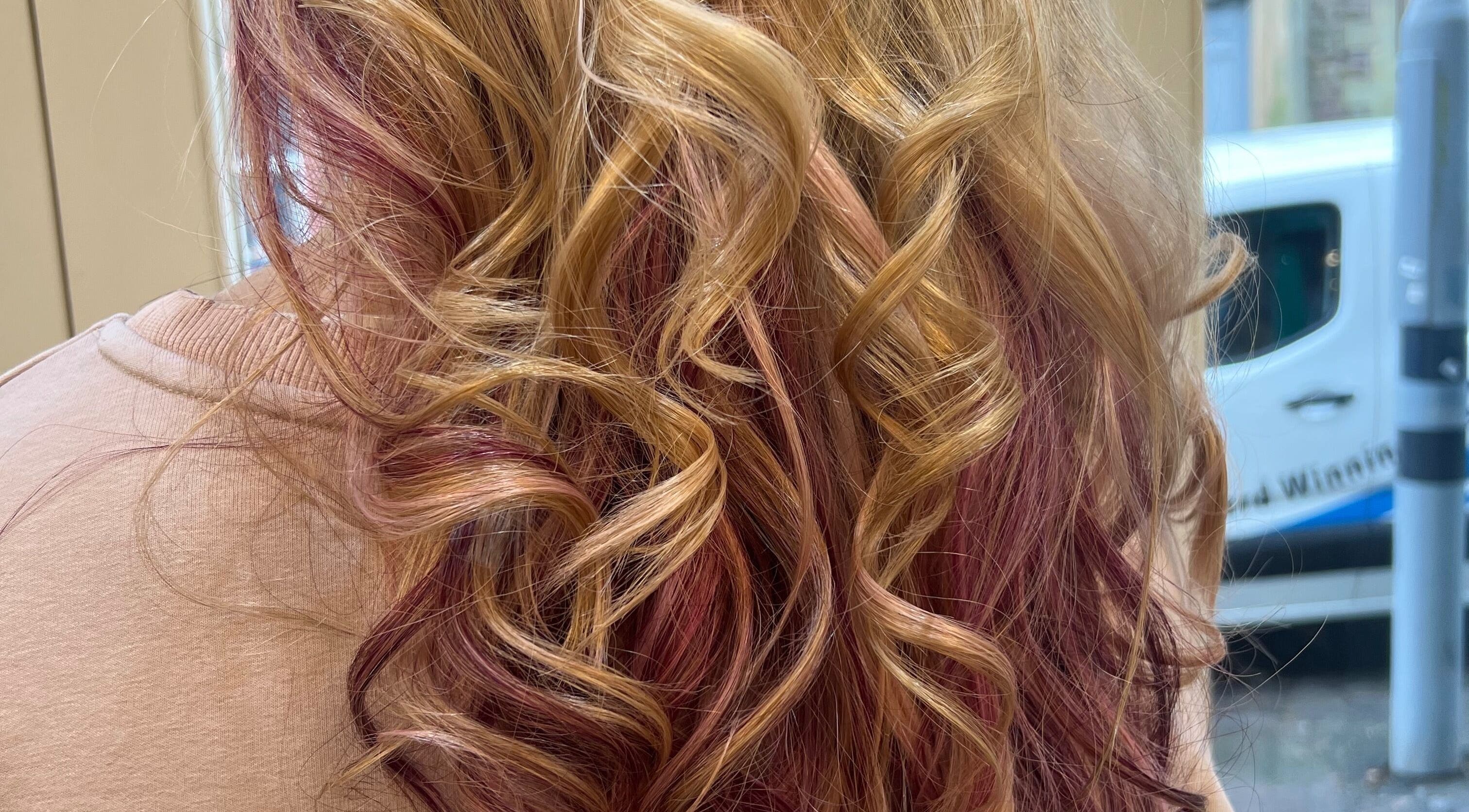 Stylish blonde and pink curls at Violets in Callander, Scotland, GB showcasing premium hair styling.
