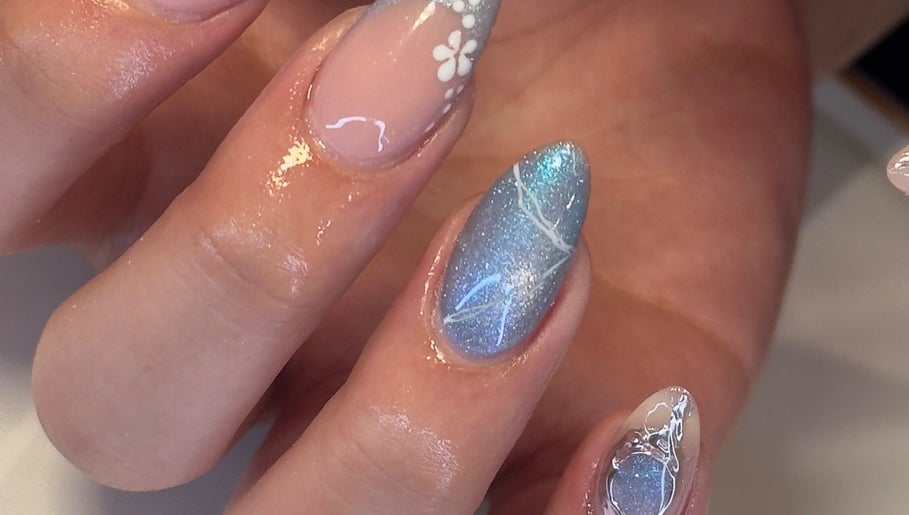 Beautifully manicured nails with floral and glitter details at Chill Nails Sydney, Bonnyrigg, New South Wales, AU.
