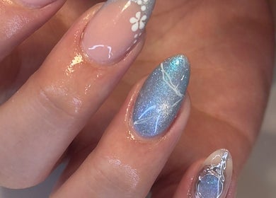 Beautifully manicured nails with floral and glitter details at Chill Nails Sydney, Bonnyrigg, New South Wales, AU.