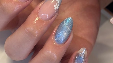Beautifully manicured nails with floral and glitter details at Chill Nails Sydney, Bonnyrigg, New South Wales, AU.