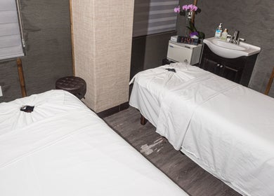 Cozy massage room at Bright Facial Spa and Thai Massage, Las Vegas, NV, US with two treatment beds.