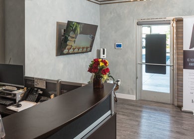 Reception area at Bright Facial Spa and Thai Massage in Las Vegas, NV, US, featuring a cozy interior and floral decor.