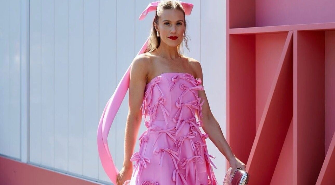 Stylish woman in a pink dress at Spray Tanning by Jessica, Bonbeach, Victoria, AU.