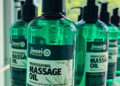 Jinsei Massage - Pila Branch massage oils in Pila, Calabarzon, PH displayed elegantly on a shelf.
