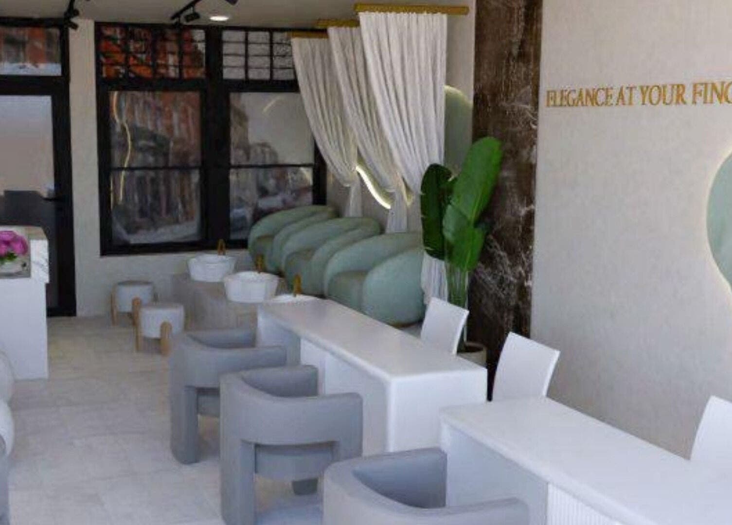 Chic interior of Biab Nails Balham in London, England, GB with plush seating and modern decor.