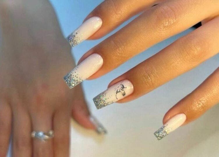 Elegant glitter-tipped nails at Biab Nails Balham, London, England, GB showcasing silver sparkles.