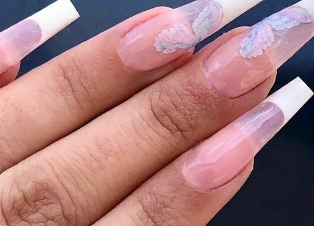 Intricate nail art design featuring pale pink manicure from Biab Nails Balham in London, England, GB.