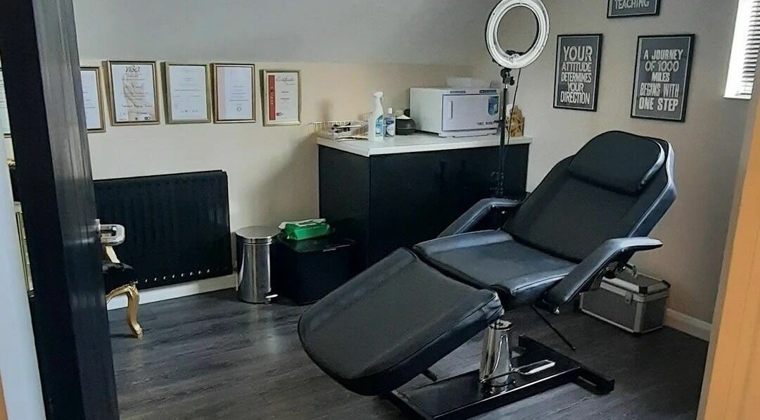 Treatment room at Beauty by Holly Nicole, Dorking, England, GB, featuring a modern recliner and certificates.