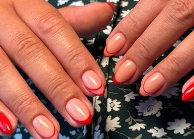 Beautiful red-tipped manicure at Sadiou's Lab in Bali, Bali, ID showcasing elegant nail designs.