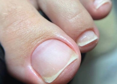Close-up of a well-groomed toenail at Sadiou's Lab, Bali, Bali, ID. Showcasing pedicure excellence.