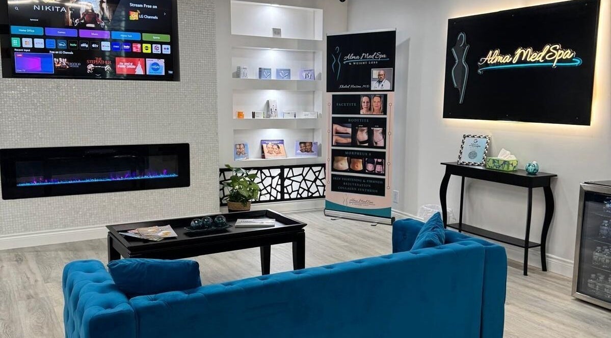 Cozy lounge at Alma MedSpa & Weight Loss, St. Peters, Missouri, US with modern decor and comfortable seating.