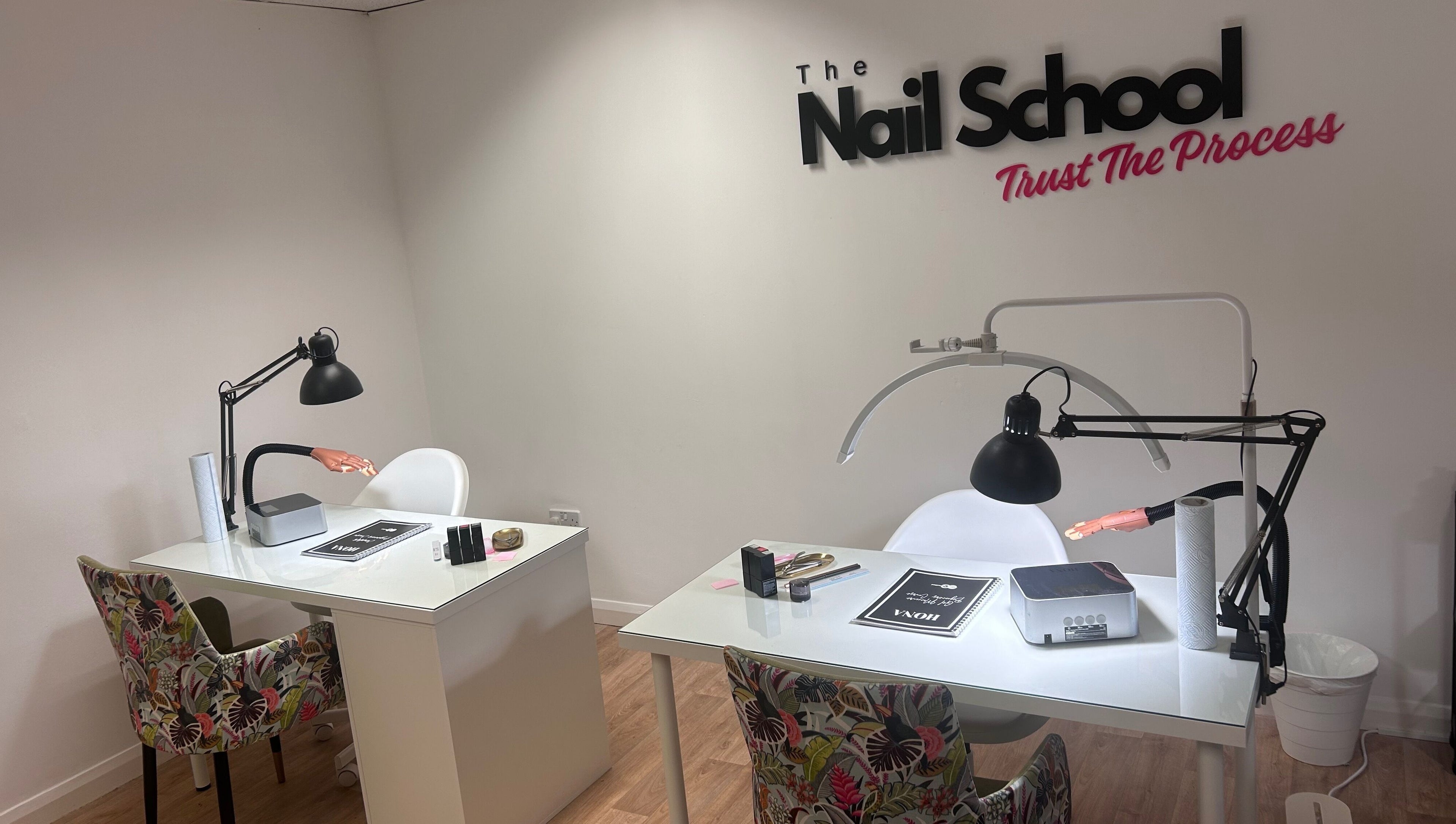 Elegant training desks at The Nail School in Middleton, England, GB, showcasing professional nail education setup.