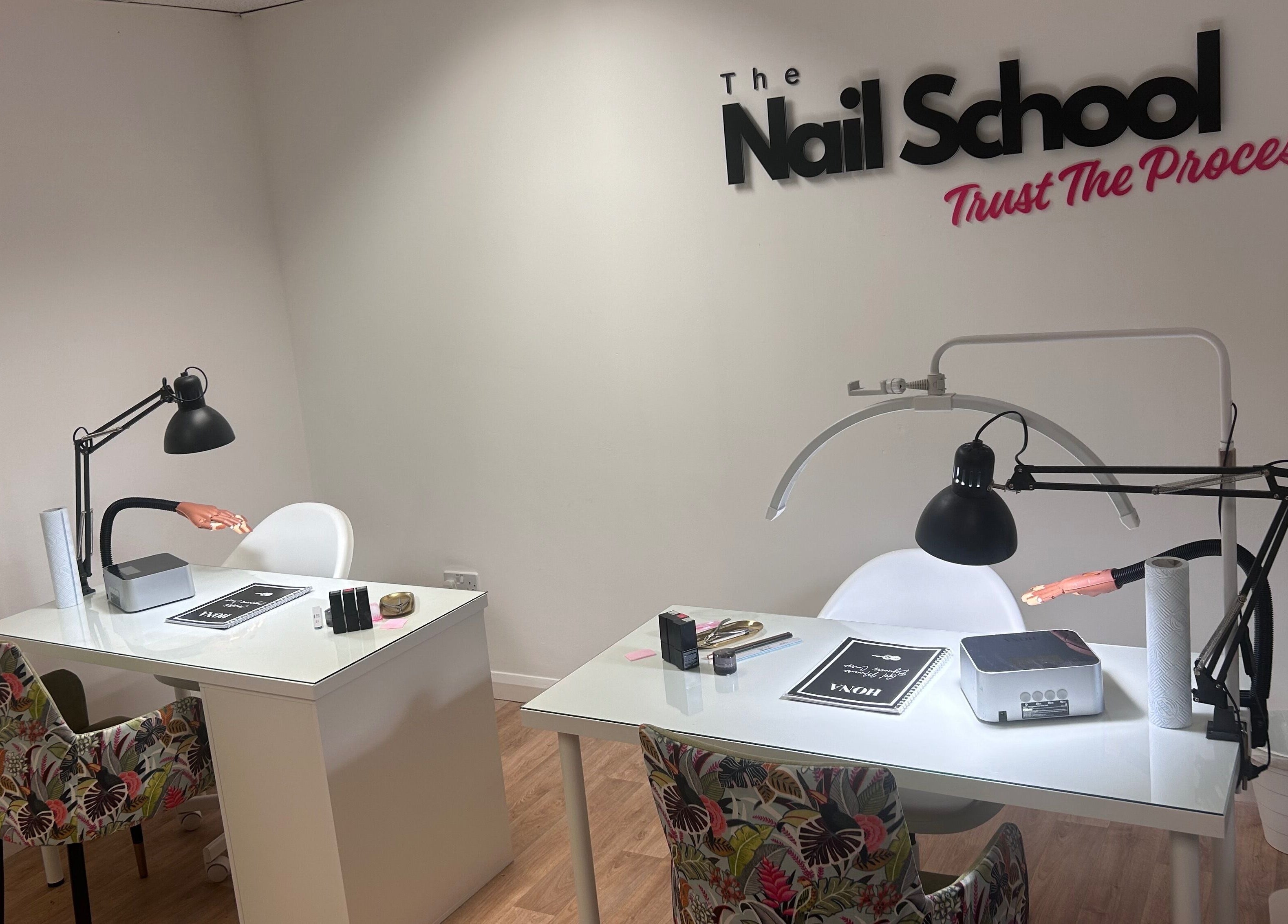 Elegant training desks at The Nail School in Middleton, England, GB, showcasing professional nail education setup.