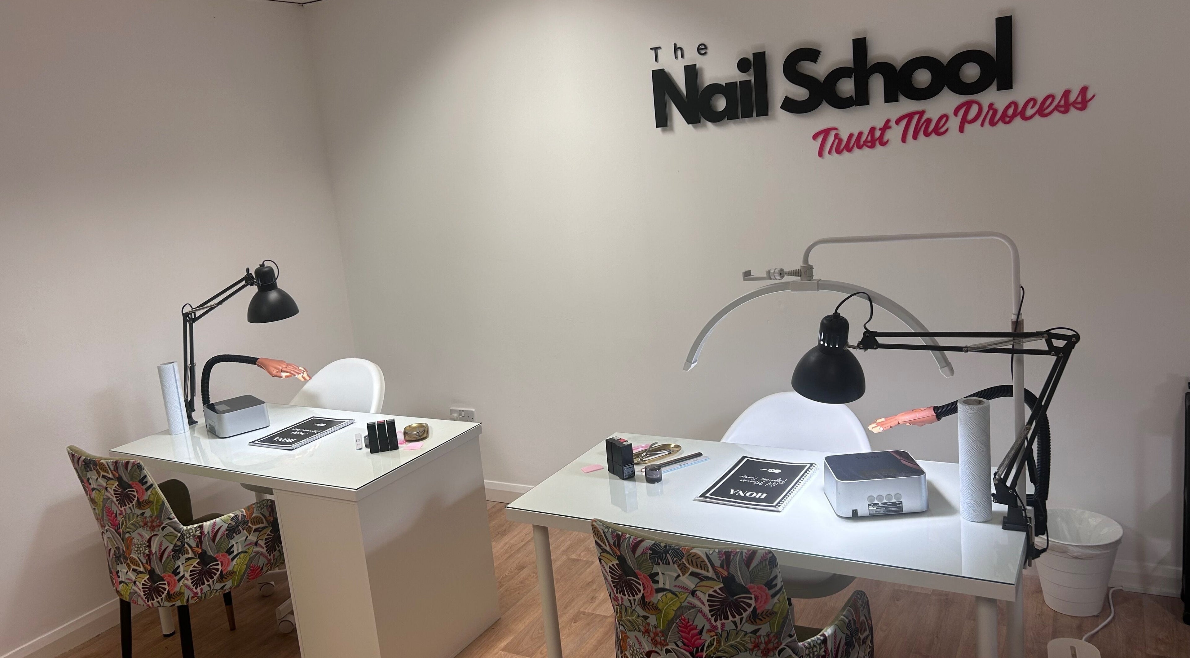 Elegant training desks at The Nail School in Middleton, England, GB, showcasing professional nail education setup.