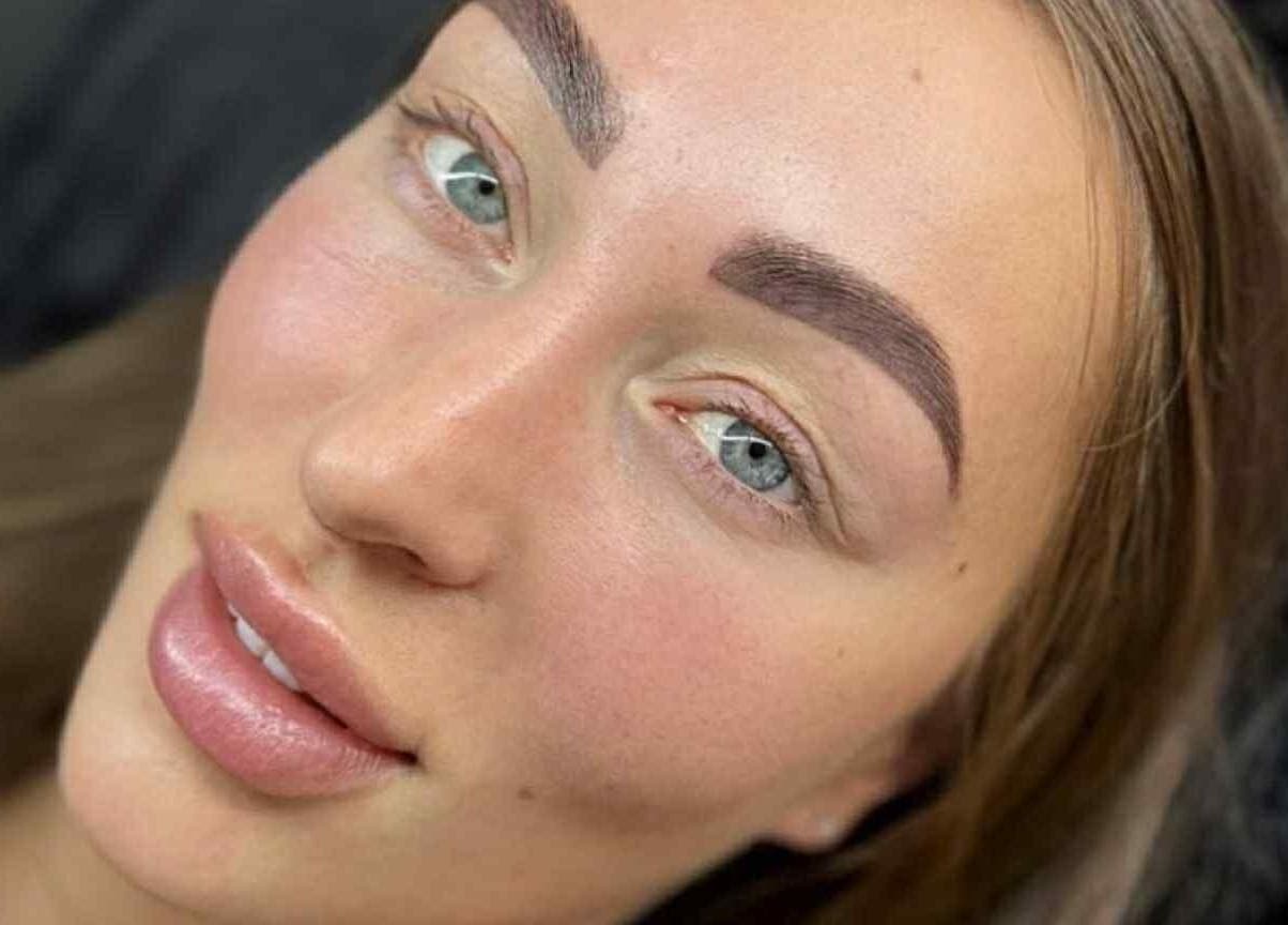 Close-up of perfectly groomed eyebrows at G L O Y À, Rochester, England, GB, showcasing expert beauty treatment.