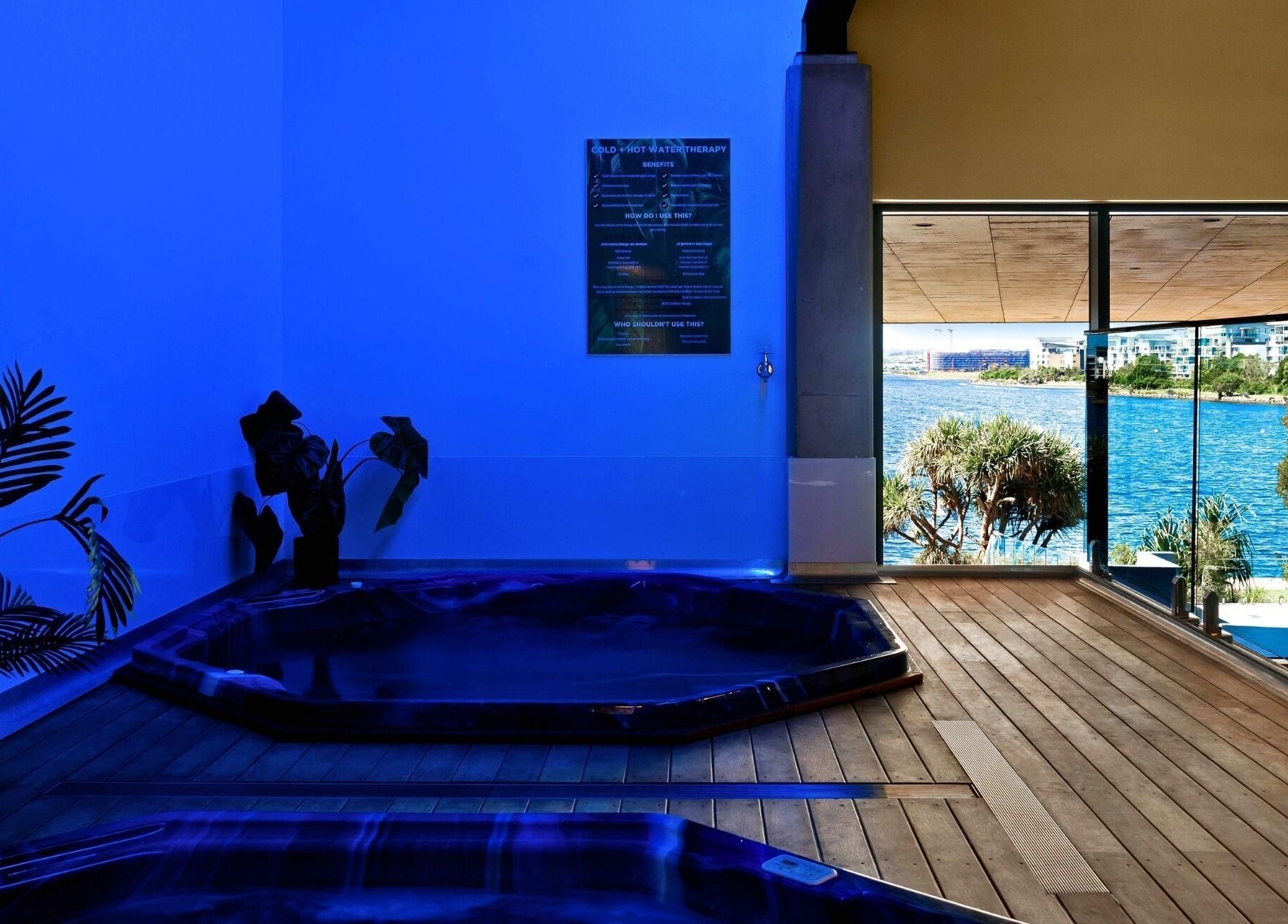 Interior of Recovery Room Kawana Waters with spa overlooking waterfront in Bokarina, Queensland, AU.