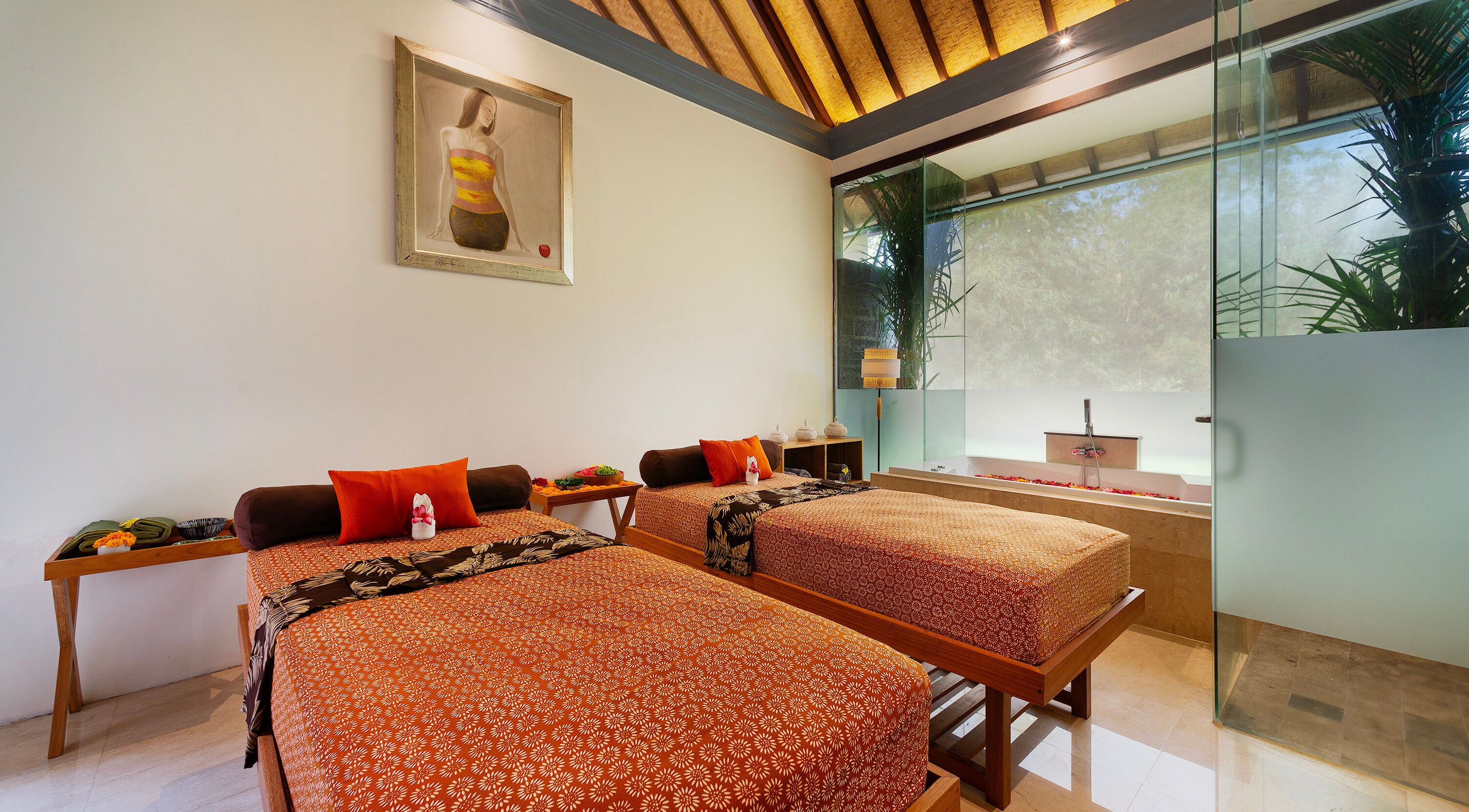 Luxurious spa room at Jivana Spa, Bali, Bali, ID featuring two massage tables and a soothing atmosphere.