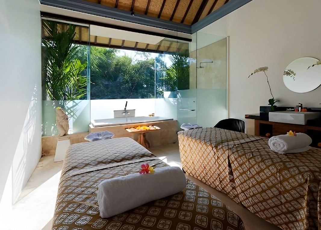 Relaxing massage room at Jivana Spa, Bali, Bali, ID with natural light and tranquil decor.