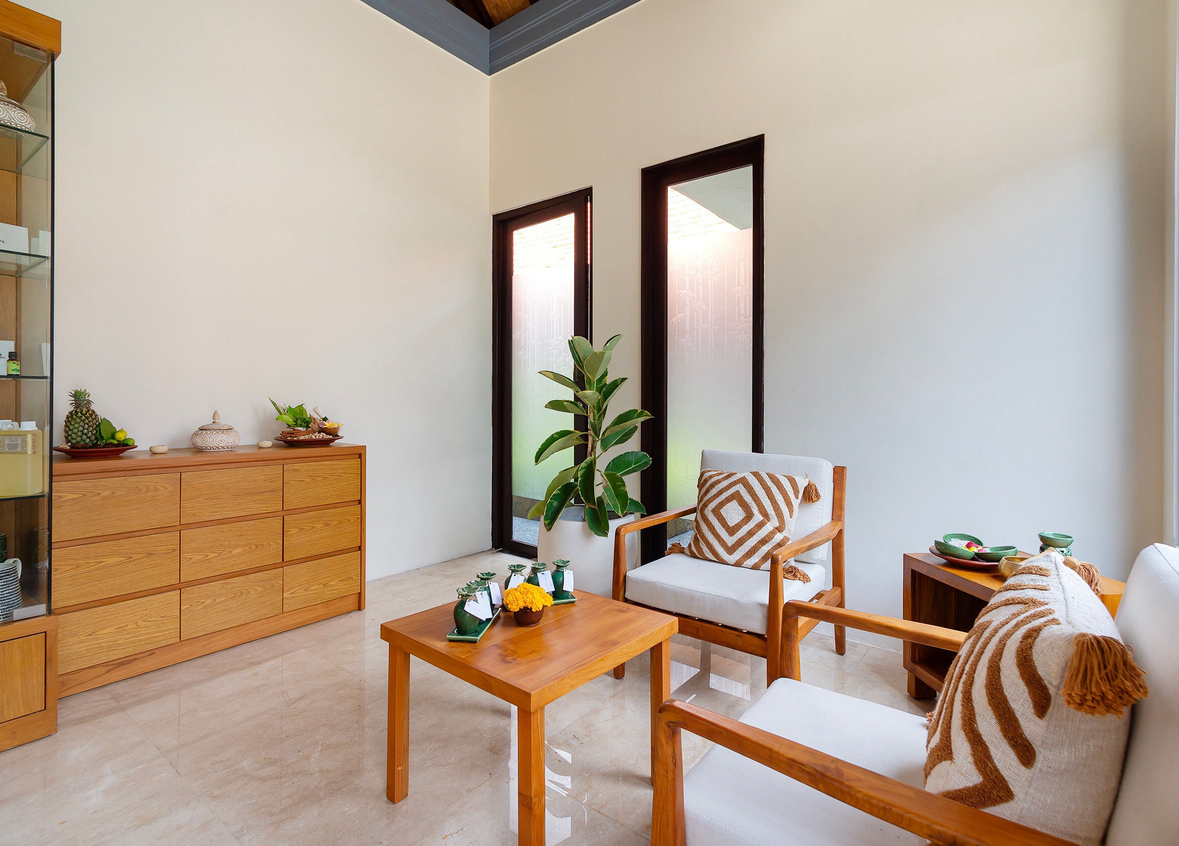 Calming Jivana Spa lounge in Bali, Bali, ID with wooden decor and natural light.
