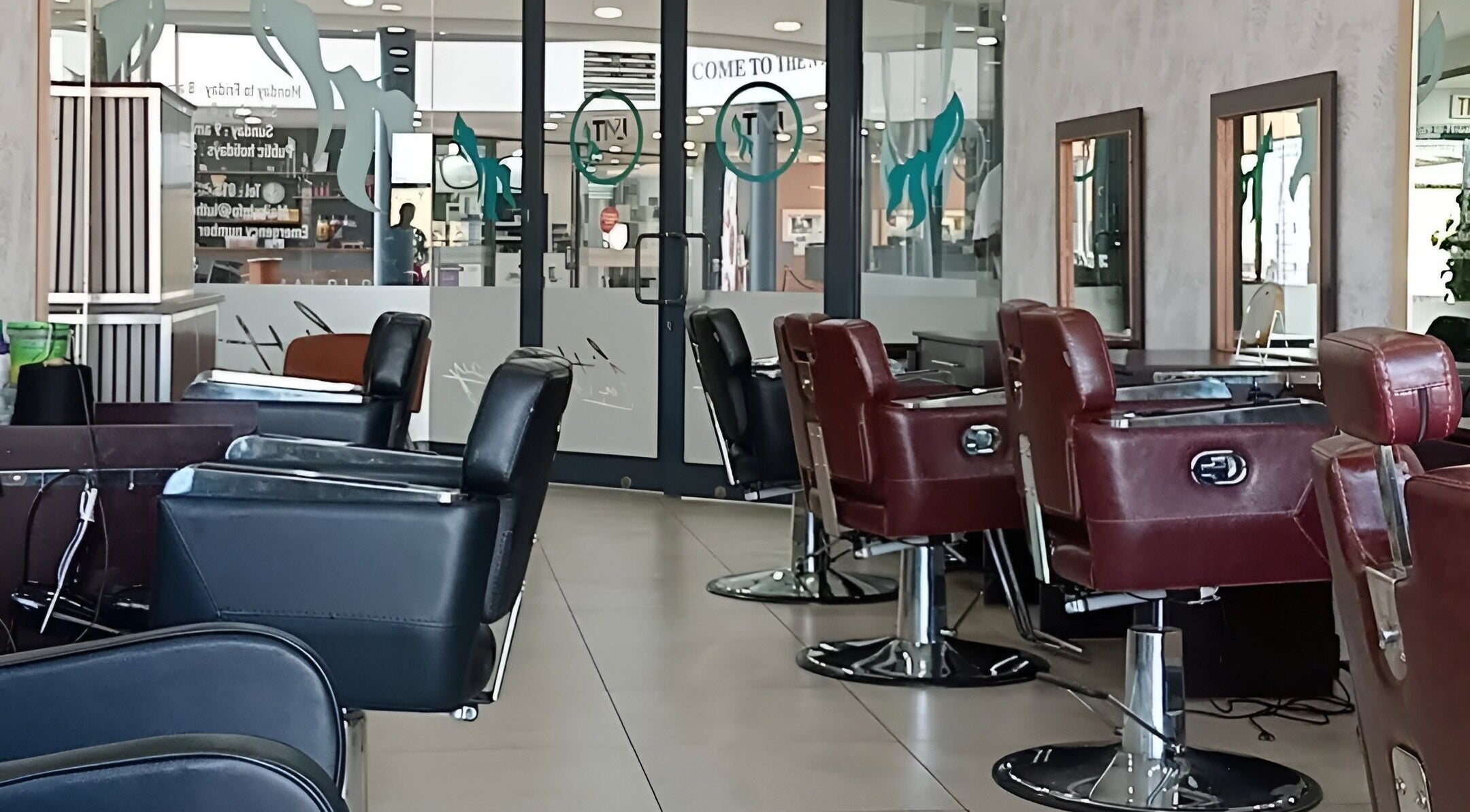Modern salon interior at LMT Hair and Beauty Salon, Thohoyandou, Limpopo, ZA with sleek styling chairs.