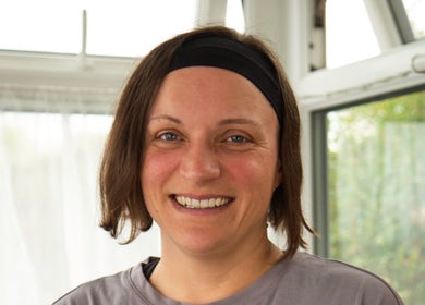 Massage therapist smiling at Sarah Sharp Massage, Copmanthorpe, England, GB, offering a welcoming ambiance.