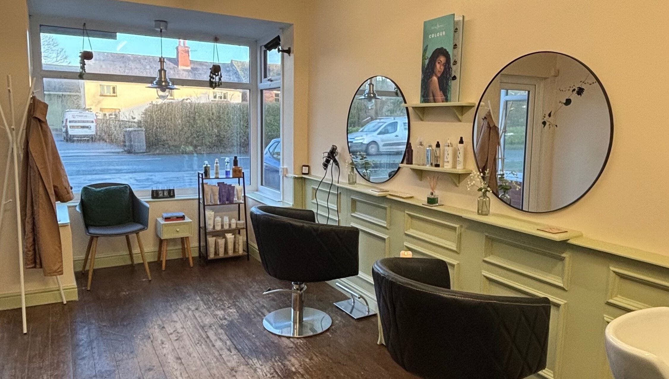 Niamh Elizabeth Hairdressing salon interior in Preston, England, GB, showcasing modern seating and stylish decor.